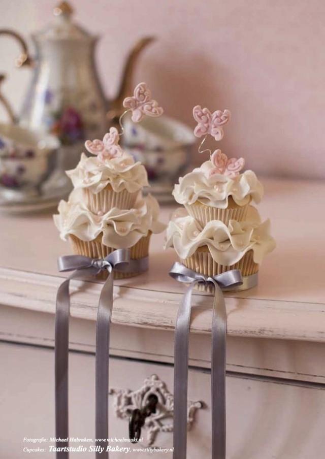 wedding photo - Wedding Cupcakes decorated with the butterfly on the top.