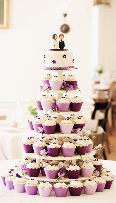 Wedding - Mountain of Wedding Cupcakes with a beautiful couple on the top