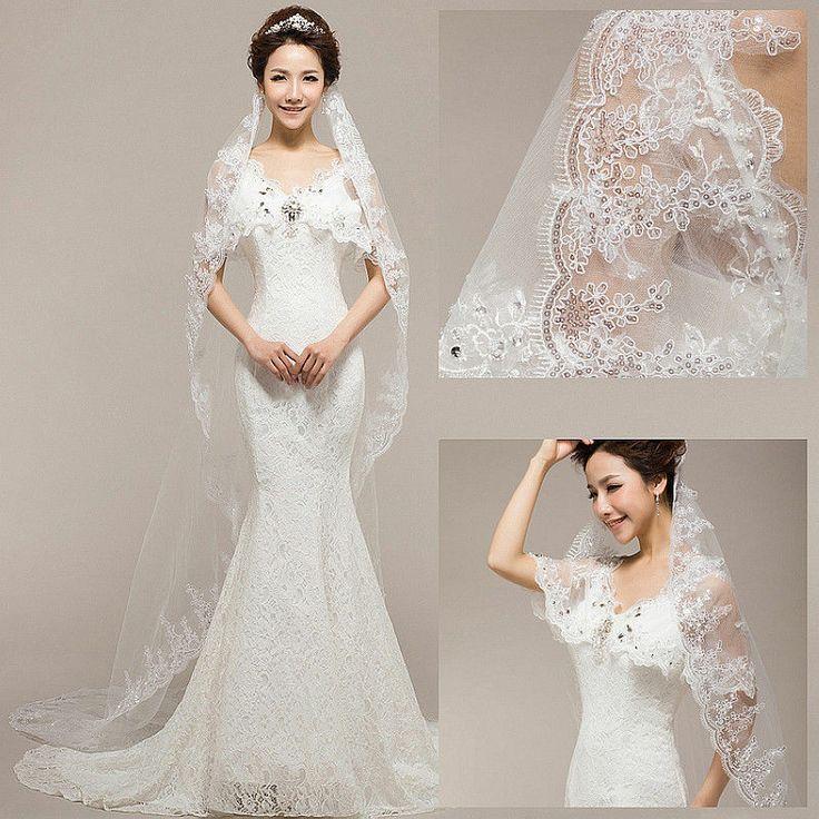 Wedding - Floor length white colored veil with the white lace gown.