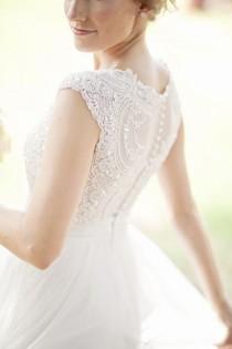 wedding photo - Elegant white wedding with cup shaped sleeves