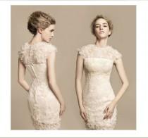 wedding photo - Ivory bridesmaid dress decorated with feathers